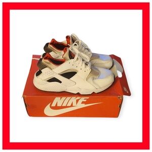 Nike Women's White and Black Sneakers with Red Accents